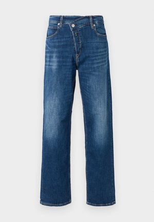 Mørkeblå denim jeans med lige pasform, fem lommer, knap- og lynlåslukning, samt let falmning på lårene.