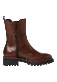 Brun läderankelboot med sidodragkedja, dragtabb bak och tjock svart gummisula för fäste och hållbarhet.