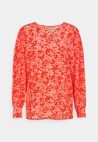 Langärmlige Bluse in lebhaftem Koralle mit einem abstrakten roten Muster. Hergestellt aus leichtem Stoff, mit rundem Ausschnitt und weicher Textur.