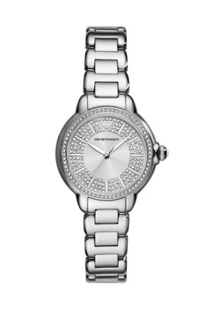 Silver metal watch with a round face, rhinestone embellishments, and a polished link bracelet. Features a simple dial and crown.