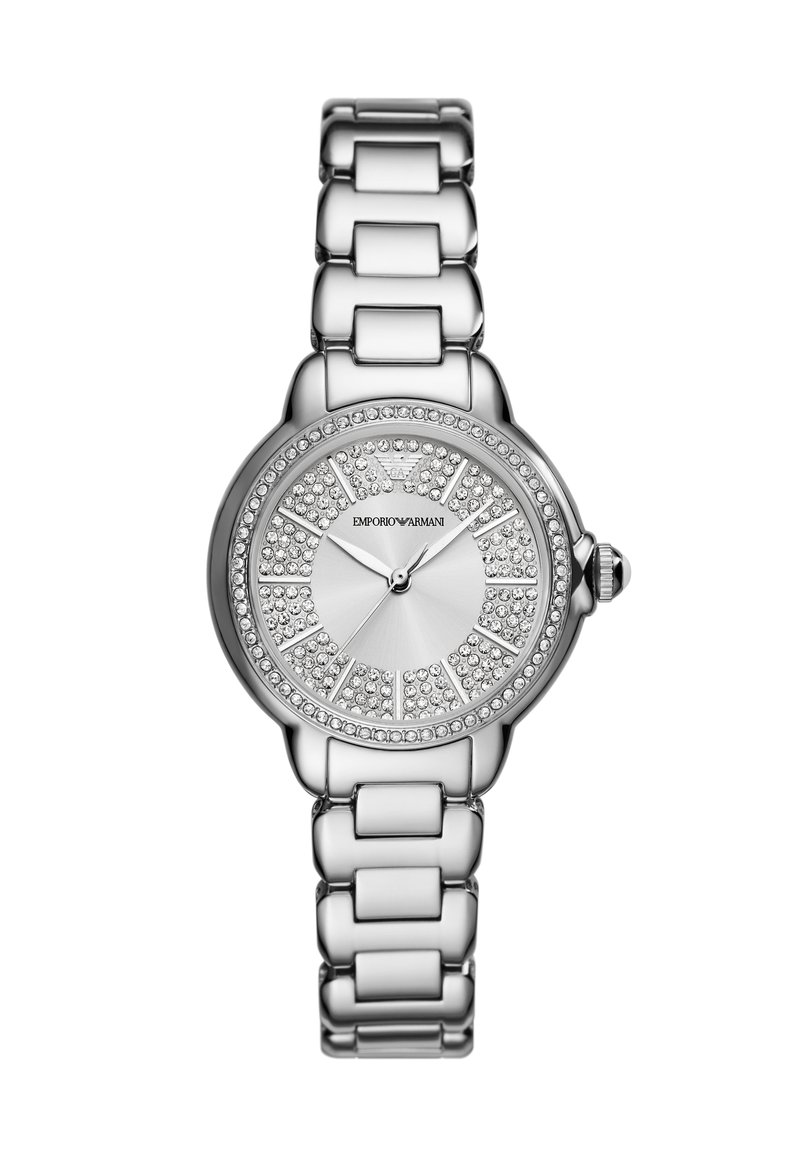 Silverfärgad metallklocka med rund urtavla, rhinestones och en polerad länkarmband. Har en enkel urtavla och krona.