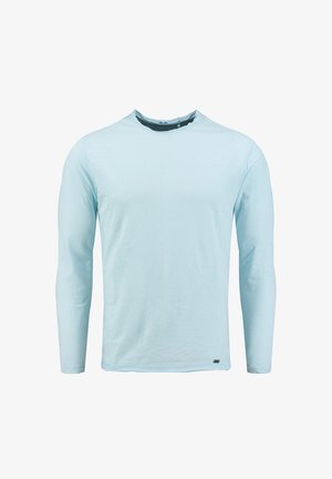 Jasnoniebieska bluzka z długim rękawem z miękkiego materiału z okrągłym dekoltem. Posiada prosty krój oraz subtelne logo na dolnym lewym boku.