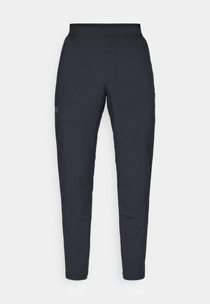 Svarta träningsbyxor med en slät yta, slim fit, elastisk midja och sidofickor. Har en liten logotyp på vänstra låret.