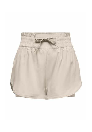 Beige athletic shorts with an elastic waistband, adjustable drawstring, and side slits for enhanced movement. Smooth, lightweight fabric.