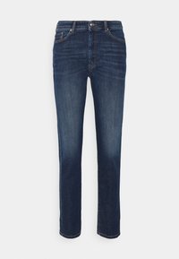 Tmavě modré džíny z denimu s klasickým rovným střihem, s jemným šisováním a předním zapínáním na knoflík. Prémiové detaily šití.