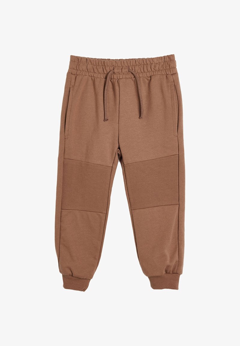 Brązowe spodnie dresowe z elastycznym pasem, sznurkiem, żeberkowymi panelami na kolanach, bocznymi kieszeniami i elastycznymi mankietami u kostek.