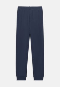 Pantalones de chándal de algodón azul marino con cintura elástica, piernas ajustadas y puños acanalados en los tobillos, con una textura suave.