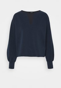 Námořnicky modrá krátká mikina s výstřihem do "V", dlouhými balónovými rukávy a žebrovanými manžetami. Vyrobená z měkké, texturované látky. Minimalistický design.