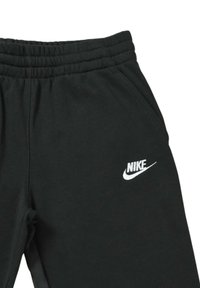 Pantalones de chándal negros de mezcla de algodón, con cintura elástica, bolsillos laterales y un logo de Nike blanco en el muslo izquierdo.