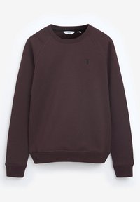 Sudadera burdeos hecha de una tela suave con puños y cuello acanalados. Presenta un pequeño logo negro en el pecho. Mangas largas tipo ranglán.