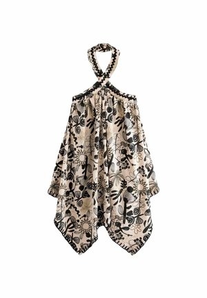 Beżowa sukienka na szyi z czarnymi abstrakcyjnymi wzorami kwiatowymi i słonecznymi, z asymetrycznym dołem i luźnym, swobodnym materiałem.