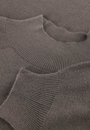 Knitted gray sweater with a ribbed crew neck, featuring varied textures and patterns on the body and sleeves.