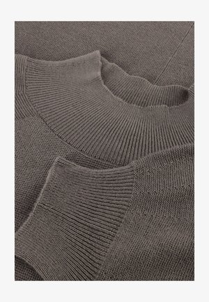 Knitted gray sweater with a ribbed crew neck, featuring varied textures and patterns on the body and sleeves.