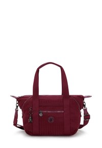 Burgundy handbag with textured material, dual handles, a detachable shoulder strap, and zippered pockets. Features logo and charm accents.