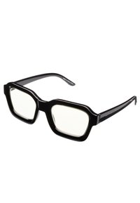Gafas de plástico negro con montura cuadrada sobredimensionada, lentes transparentes y superficie lisa y brillante. Presenta acentos gruesos alrededor de los lentes.