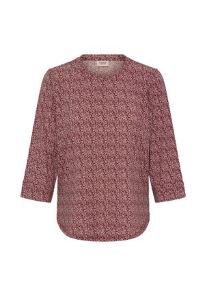 Bordó blúz kerek nyakkivágással és háromnegyedes ujjakkal. Könnyű anyagon apró virágmintával. Ívelt szegély.
