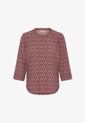 Bordó blúz kerek nyakkivágással és háromnegyedes ujjakkal. Könnyű anyagon apró virágmintával. Ívelt szegély.