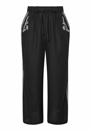 Black linen culottes with an elastic waistband. Features white floral embroidery along side pockets and a drawstring tie at the waist.