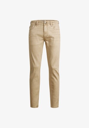 Beige denim jeans med slim fit, fem lommer, synlig søm og glidelås. Glatt tekstur og moderne vertikale linjer.