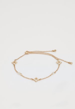 Kultaketju rannekoru kukkamaisilla linkeillä ja pienillä pyöreillä helmillä. Sisältää säädettävän pituuden mukautettavan istuvuuden saavuttamiseksi.