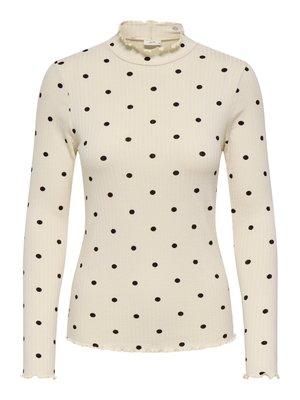 Langarmig, crèmekleurige geribbelde top met zwarte polka dots, voorzien van een gerimpelde col en een golvende zoomlijn. Comfortabele stof.
