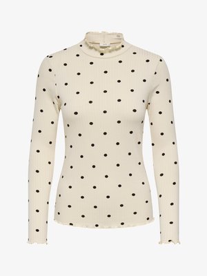 Kremowa, prążkowana bluzka z długim rękawem i czarnymi groszkami, z falbankowym stójkowym kołnierzem i falującym dołem. Wygodny materiał.