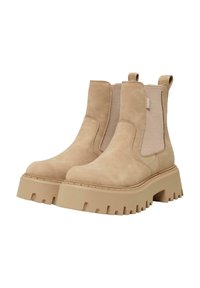 Botines de ante beige con paneles laterales elásticos, suela de goma gruesa y dibujo texturizado, que incluyen tiradores para facilitar su uso.