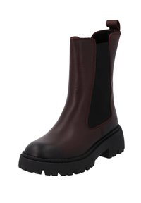 Bottines Chelsea en cuir bordeaux avec des panneaux élastiques noirs sur les côtés et une semelle en caoutchouc épaisse. Comprend une languette à l'arrière pour un enfilage facile.
