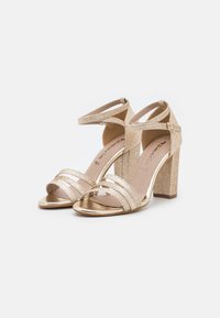 Tamaris Riemensandalette - light gold glam