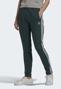 adidas Originals SUPERSTAR - Tepláky - green