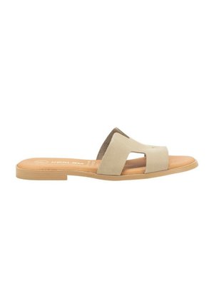 Chanclas deslizantes en color beige con una parte superior de suave ante, dos secciones recortadas, una plantilla texturizada y una suela de goma en tono marrón.