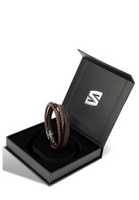 Brown braided leather bracelet with a polished stainless steel clasp, displayed in a black jewelry box with a soft black insert.