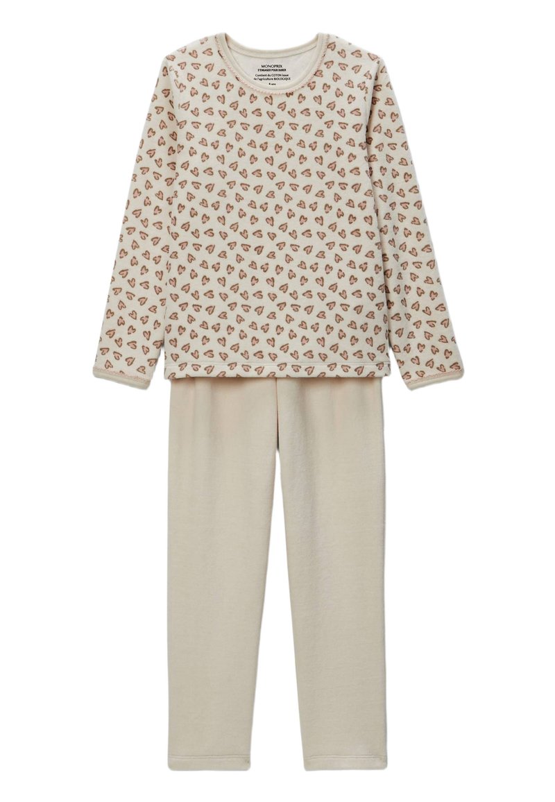 Ensemble de pyjama beige comprenant un haut à manches longues avec de petits motifs en forme de cœur éparpillés en marron, assorti à un pantalon de pyjama beige uni. Matière douce.