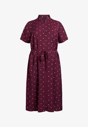 Abito chemisier bordeaux con maniche corte, pois rosa, chiusura a bottoni sul davanti e cintura annodata in vita. Tessuto morbido e leggero.