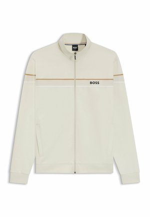 Zip-up jacket in light cream with brown and white horizontal stripes. Features BOSS logo on chest, side pockets, and ribbed cuffs.