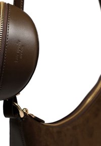 Brown leather bag with a round, zipper-closure compartment. Features gold-toned hardware and a smooth texture; logo embossed on the leather.
