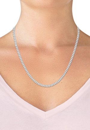 Silver-tone metal necklace with a twisted chain design, resting on a neck, accentuating a pale pink v-neck top.