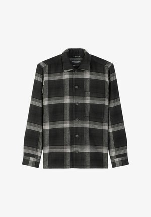Czarna i biała koszula w kratę z zapięciem na guziki, długimi rękawami i jedną kieszonką na piersi. Wykonana z fakturowanej tkaniny z kołnierzykiem.