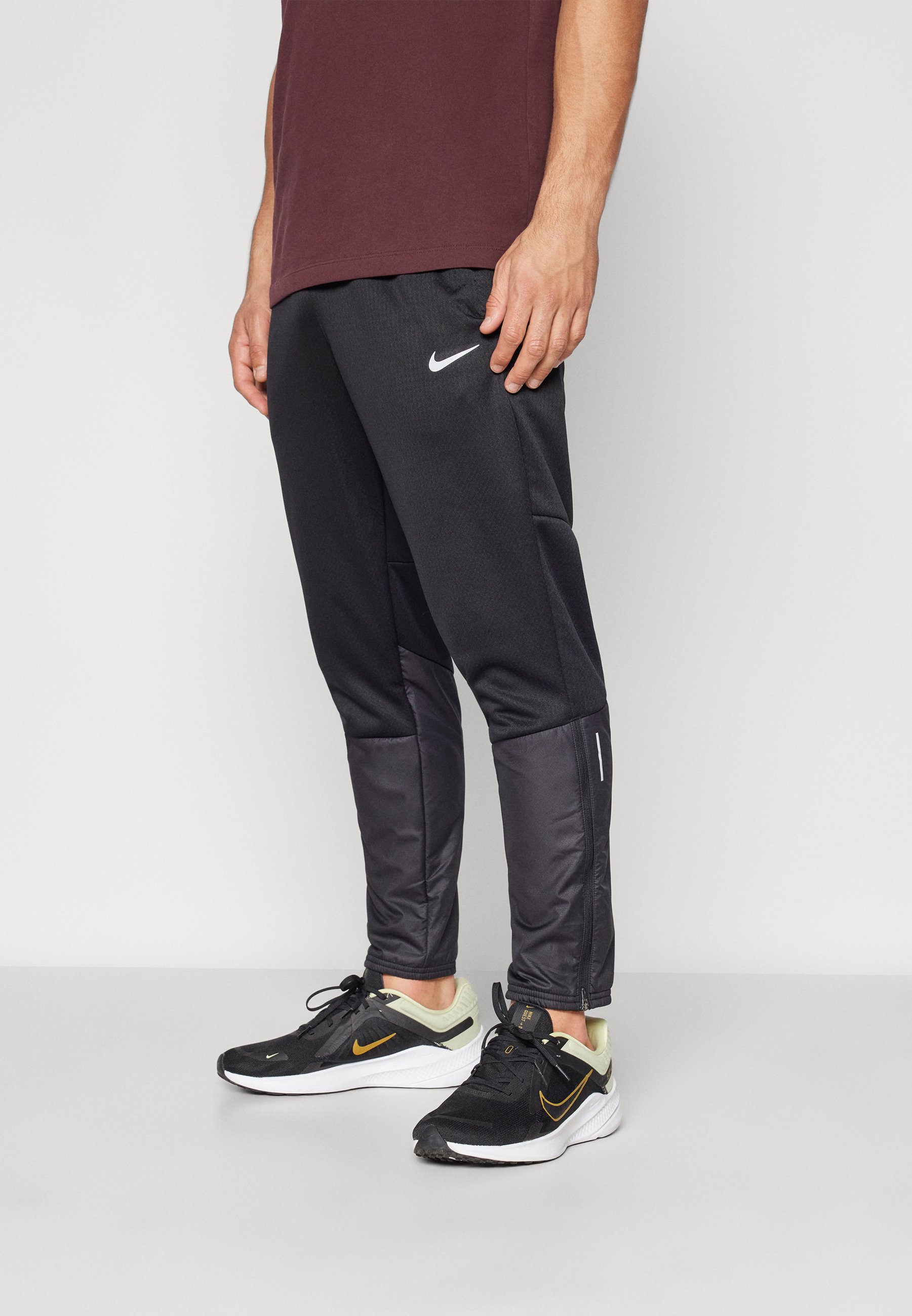 nike training pants with zipper