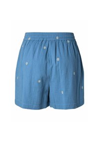 Short bleu avec une taille élastique et de petites marguerites blanches brodées dispersées sur le tissu.