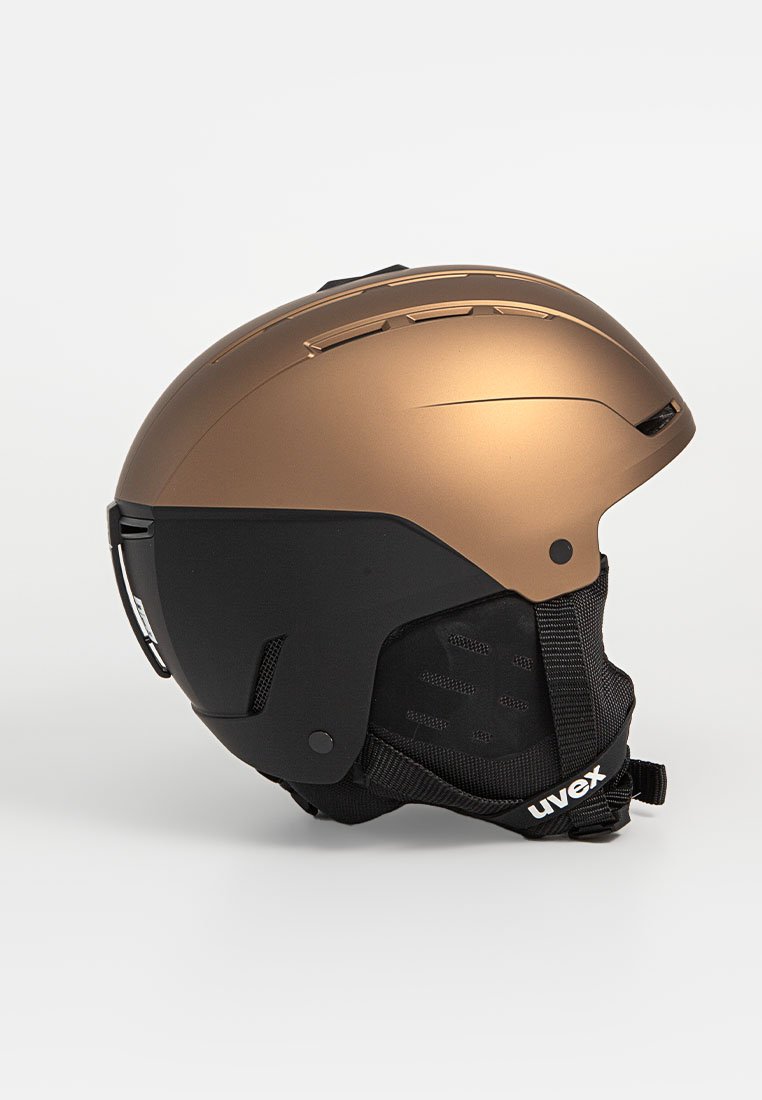 Bronzefarbener und schwarzer Skihelm mit einer glatten, matten Oberfläche, Belüftungslöchern, verstellbarem Riemen und gepolstertem Innenfutter für zusätzlichen Komfort.