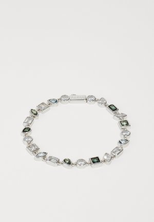 Silver bracelet featuring multiple gemstones in varied shapes—teardrop, square, and oval. Clear, green, and blue stones with a polished finish.