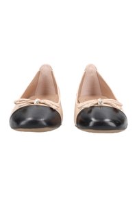 Ballet flats with a black leather toe and a beige faux leather body, featuring a bow with a decorative gem at the front.