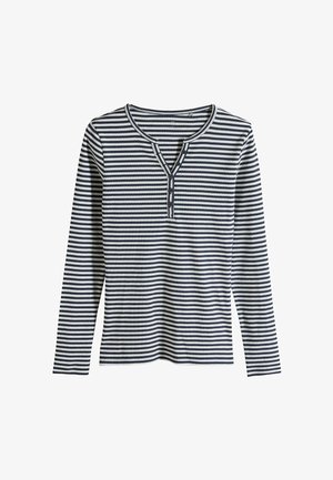 Svītraina garām piedurknēm krekls ar tumši zilām un baltām horizontālām svītrām, henley tipa izgriezums un trīs pogas uz priekša.