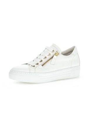 White leather sneaker with white laces, gold zipper on side, and thick white rubber sole, shown from right angled view.