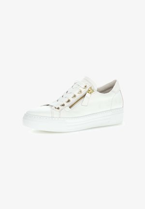 White leather sneaker with white laces, gold zipper on side, and thick white rubber sole, shown from right angled view.