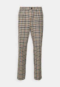 Rutig byxor med ett mönster av bruna, gröna och marinblå rutor på en krämfärgad bakgrund. Har framfickor och en rak bendesign.