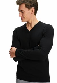 Schwarzer V-Ausschnitt-Pullover in figurbetonter Passform mit langen Ärmeln, aus feinem Strickmaterial hergestellt. Verfügt über eine glatte Textur und gerippte Bündchen.