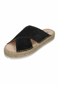 Black suede slip-on sandal with crossed upper straps, natural jute midsole, rubber outsole, and visible stitching detail.