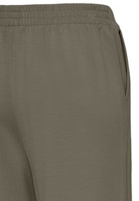 Oliivinvihreät jumppahousut, joissa on kuvioitu kangas, joustava vyötärö ja sivutaskut toiminnallisuutta varten. Sujuva pinta ja rento istuvuus.